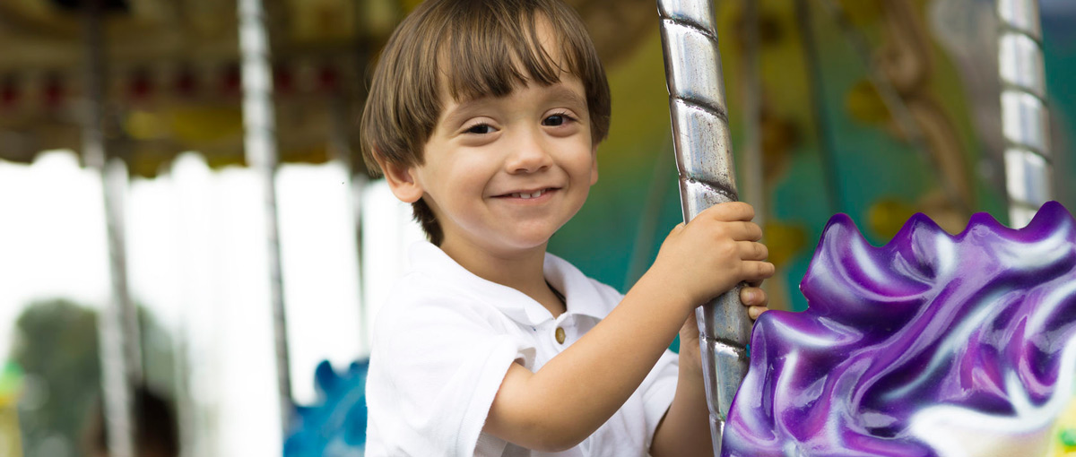 boy-on-carousel